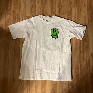 White T-Shirt with Green Smiley Graphic